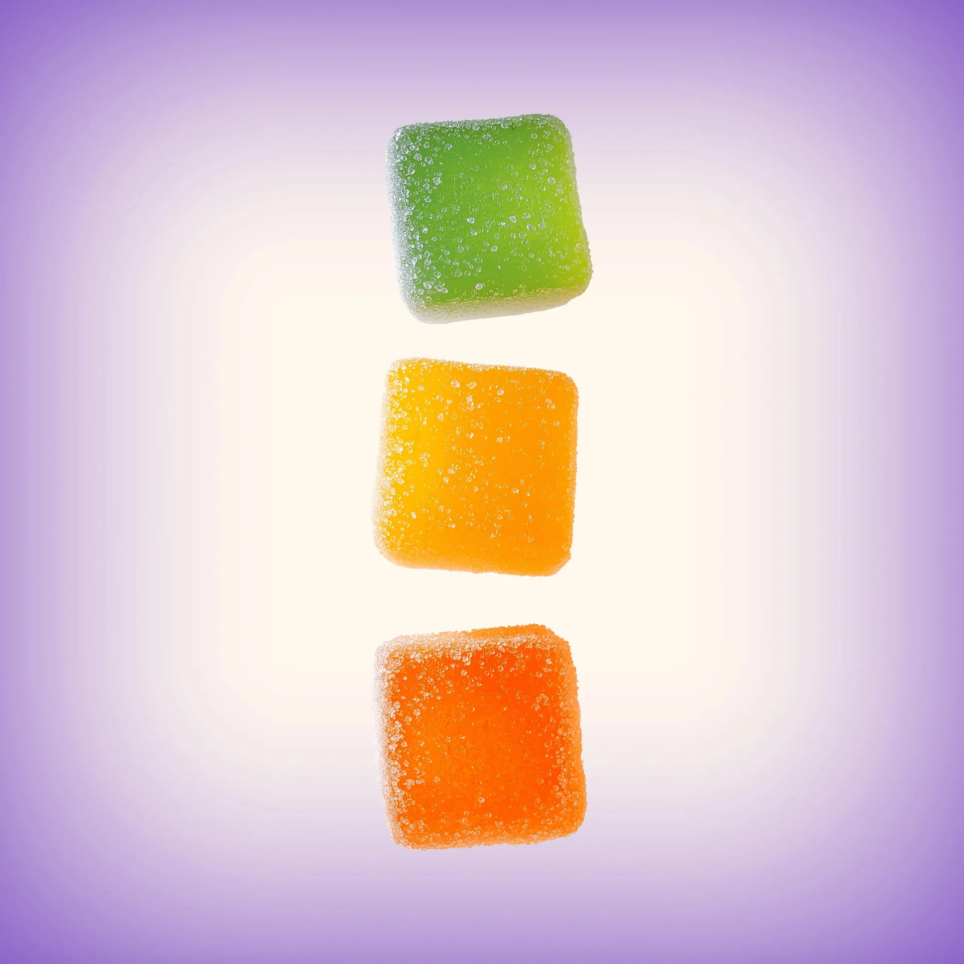 Morning Delta 9 THC Gummies - Three colorful gummies with sugar coating on purple background
